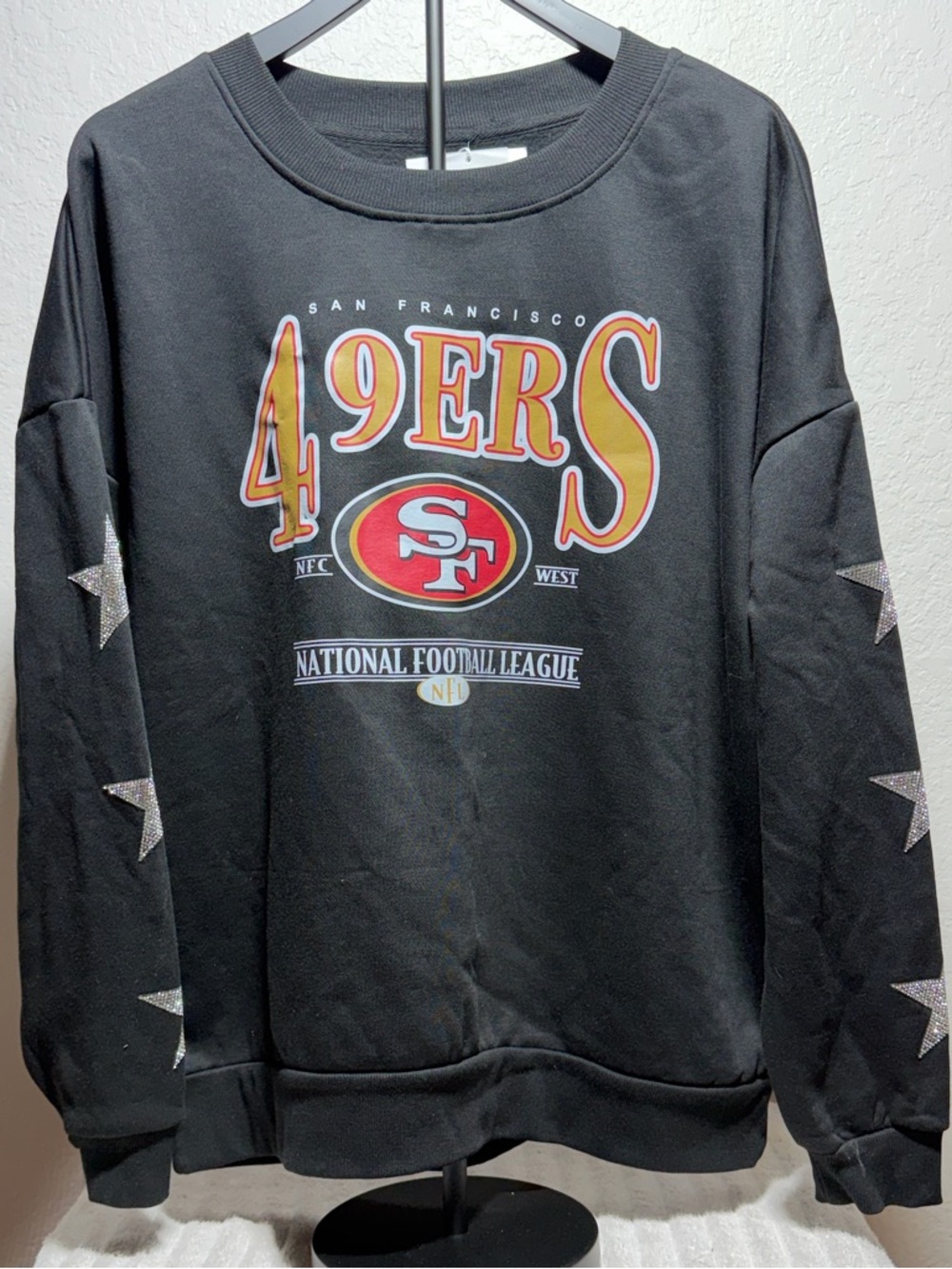 San Francisco 49ers Black Crewneck Sweatshirt with Star Sleeve Details